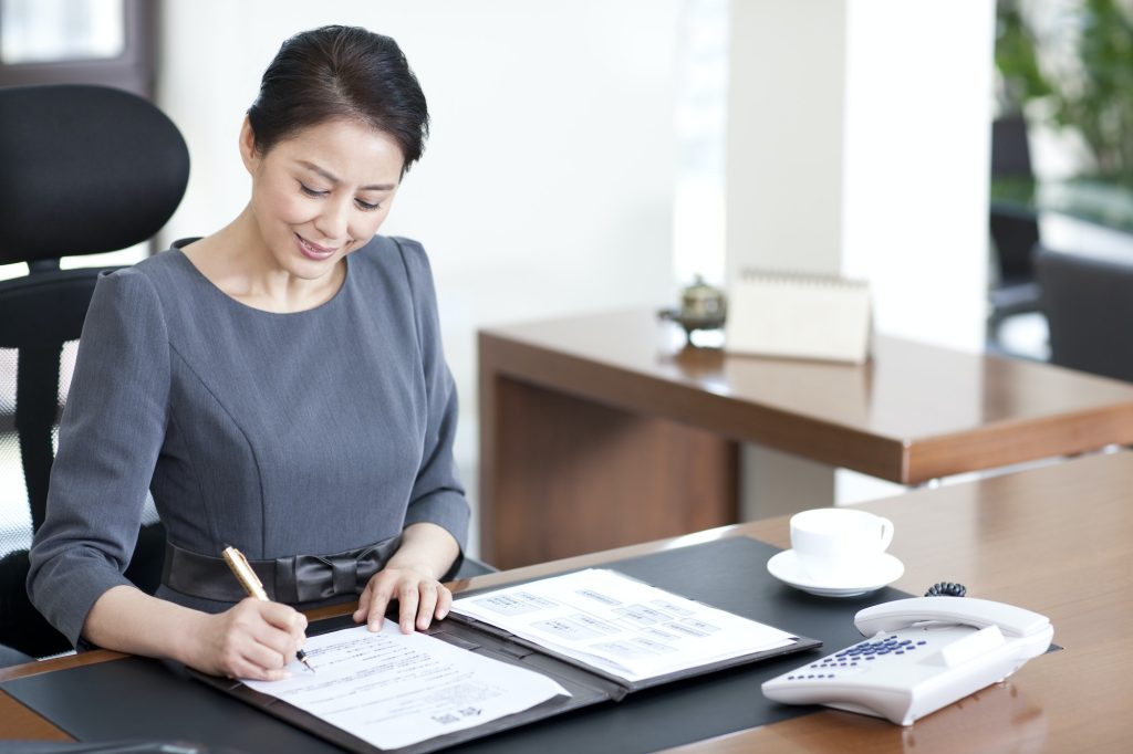 Businesswoman signing contract