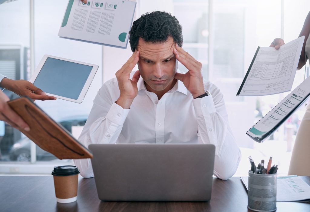 Stress, headache and burnout mindset of a business man working on laptop in office. Tax manager, le